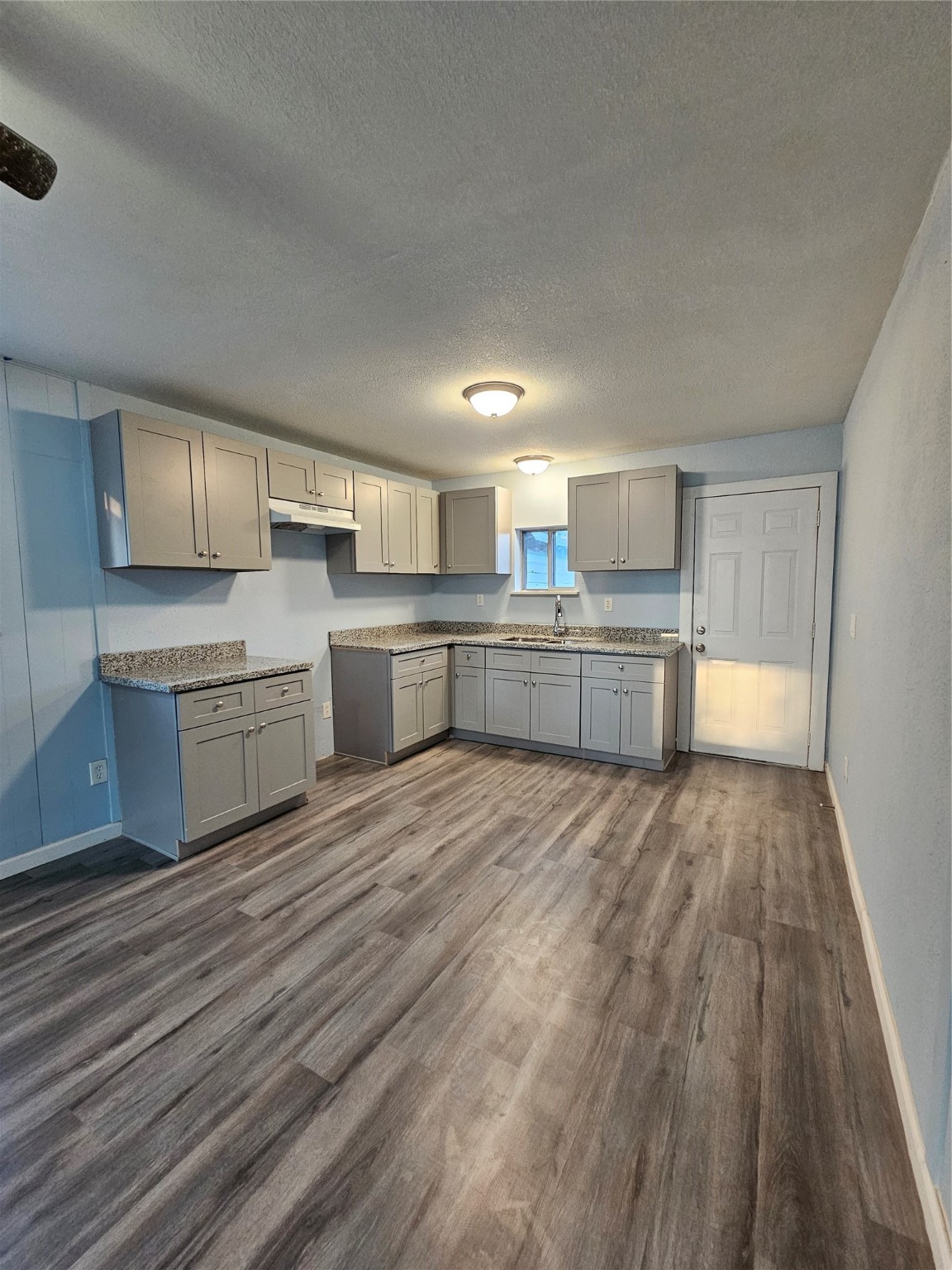7808 Bauman Road Houston, TX 77022 - Photo 2 of 11 a large kitchen with a stove a sink dishwasher and a refrigerator