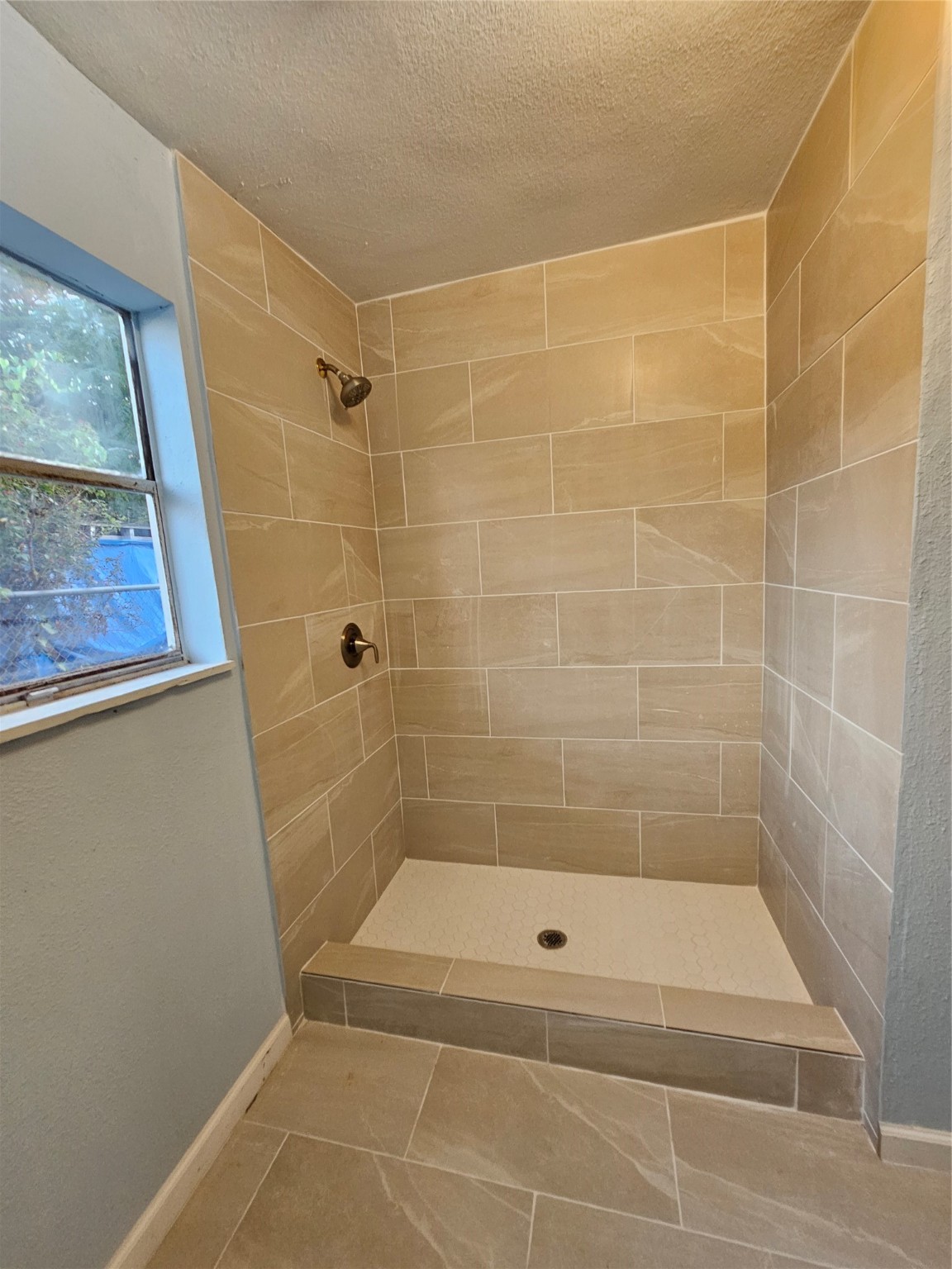 7808 Bauman Road Houston, TX 77022 - Photo 8 of 11 a bathroom with a shower