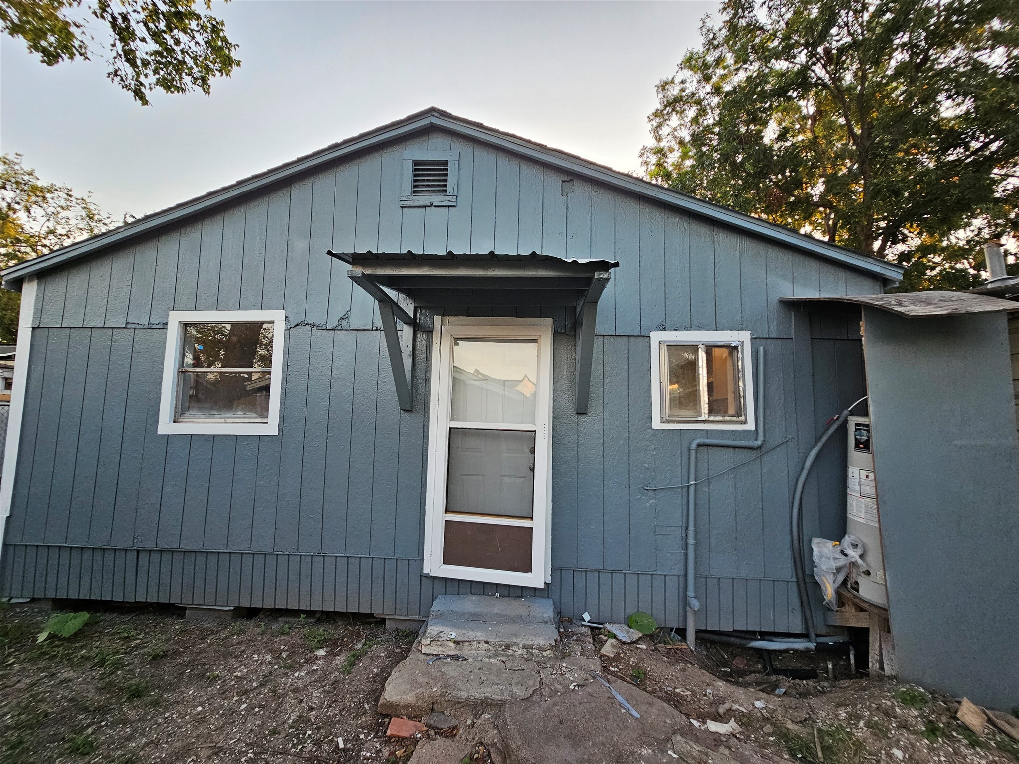 7808 Bauman Road Houston, TX 77022 - Photo 10 of 11 a front view of a house with a garden