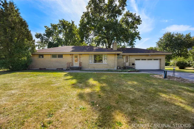 a view of house with outdoor space and yard