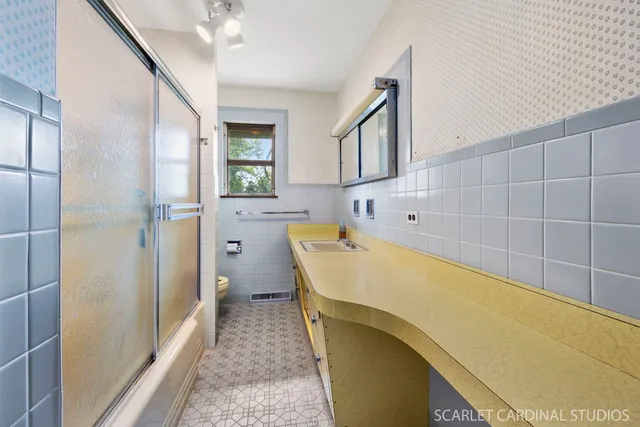 a bathroom with a bathtub and a shower