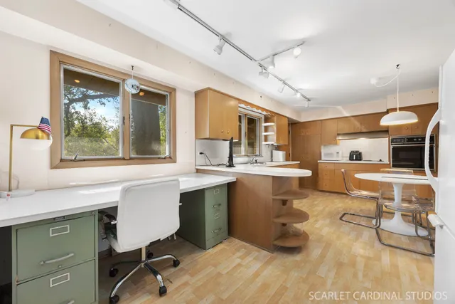 a kitchen with a sink cabinets and window