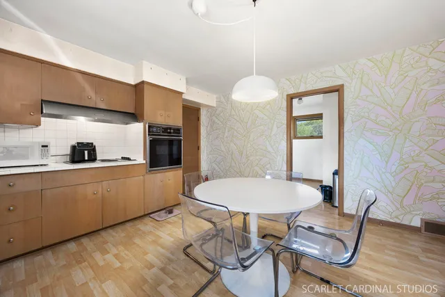 a kitchen with stainless steel appliances kitchen island granite countertop a sink and cabinets