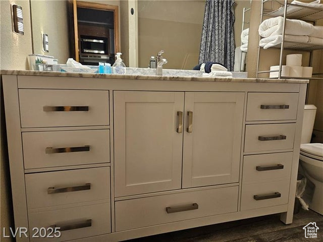 223 Hunter Ridge Drive, Unit E121 Brian Head, UT 84719 - Photo 8 of 35 Bathroom featuring vanity and wood finished floors