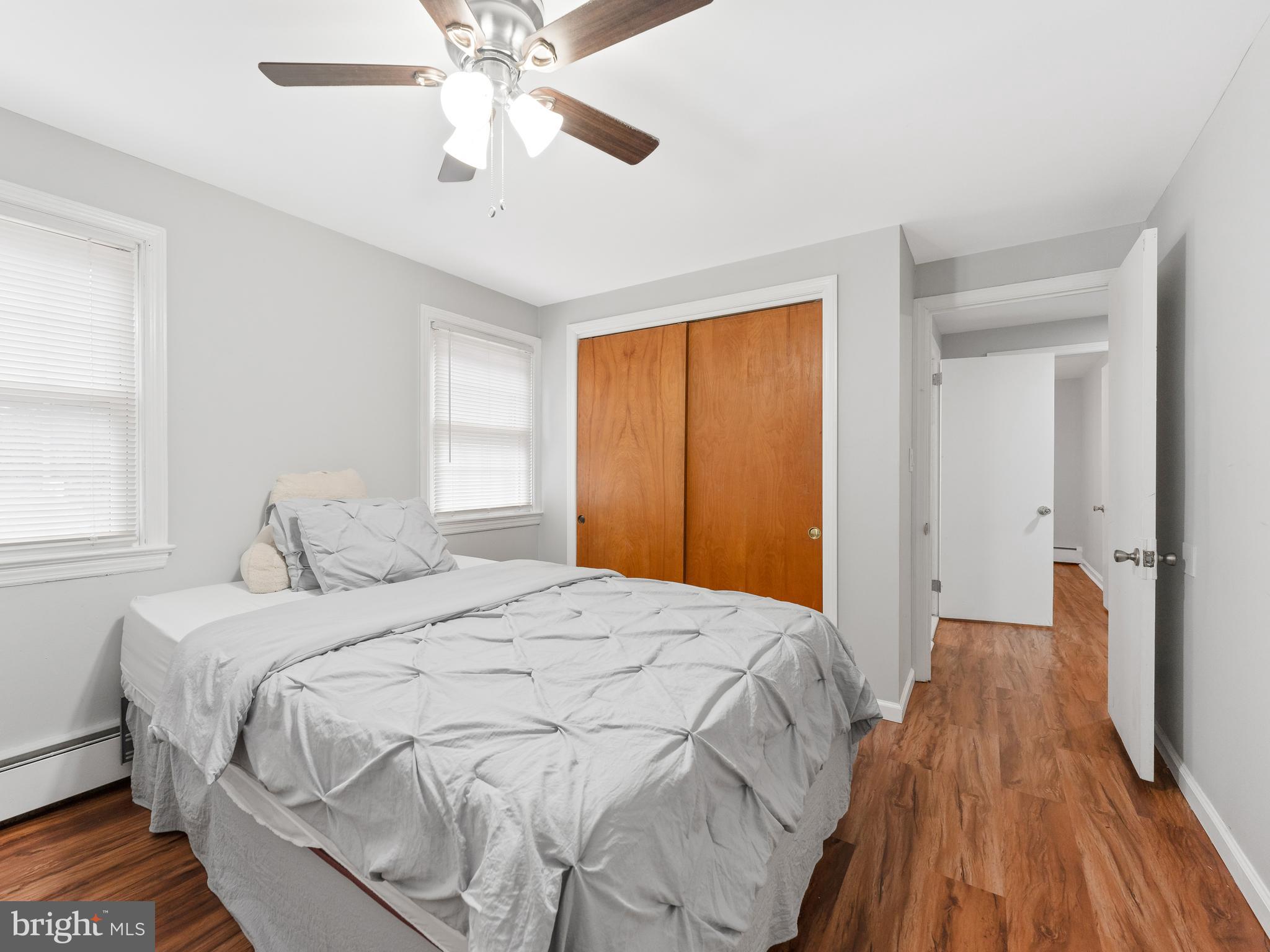 236 Boyer Road Cheltenham, PA 19012 - Photo 17 of 34 a bedroom with a bed and a chandelier