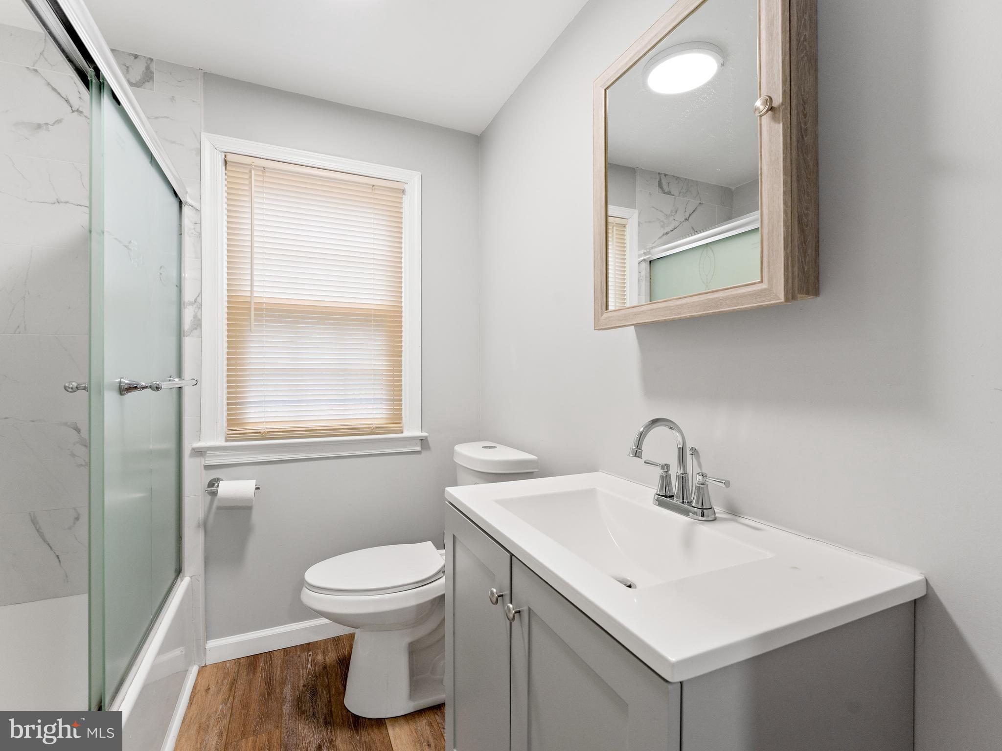 236 Boyer Road Cheltenham, PA 19012 - Photo 18 of 34 a bathroom with a toilet sink and mirror