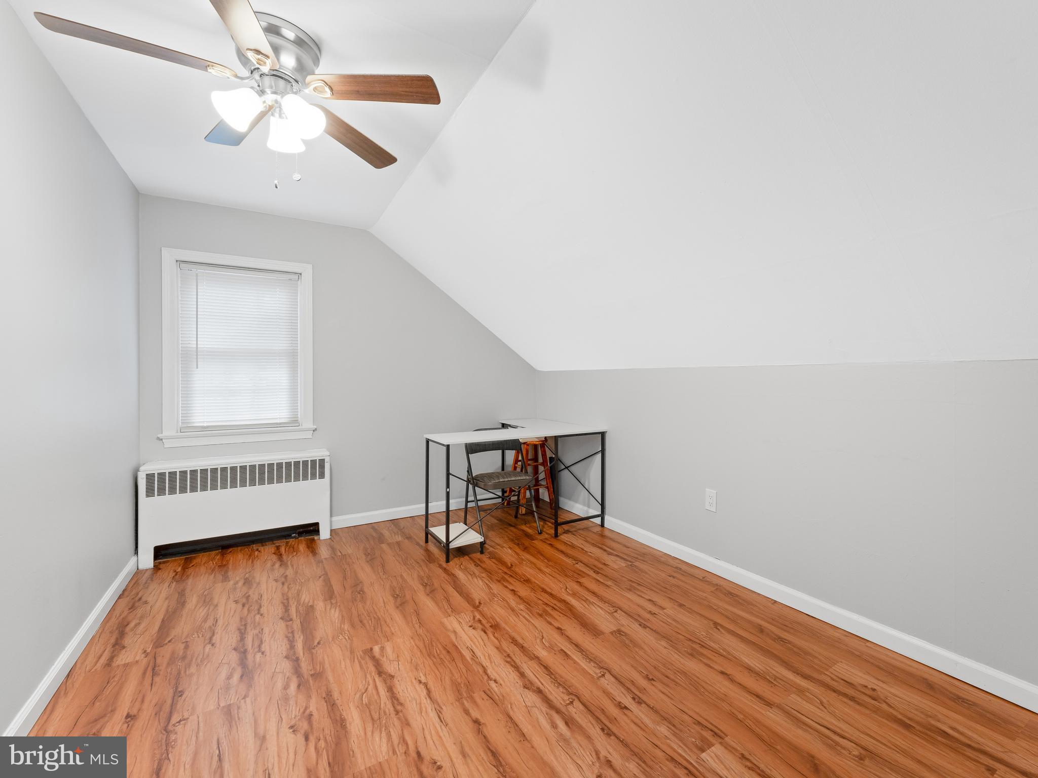 236 Boyer Road Cheltenham, PA 19012 - Photo 21 of 34 wooden floor in a hall with a window