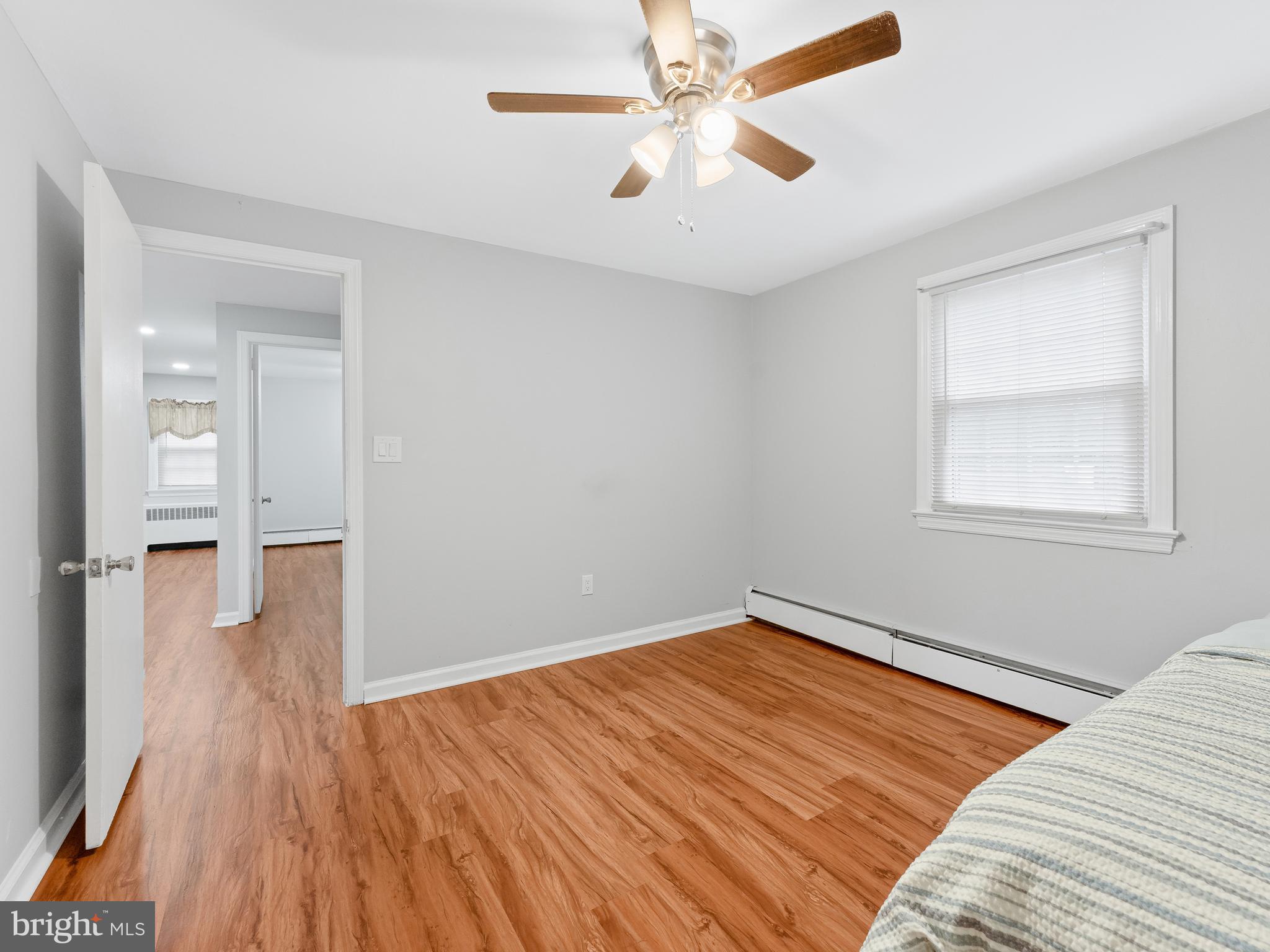 236 Boyer Road Cheltenham, PA 19012 - Photo 24 of 34 a view of a room with wooden floor and a ceiling fan
