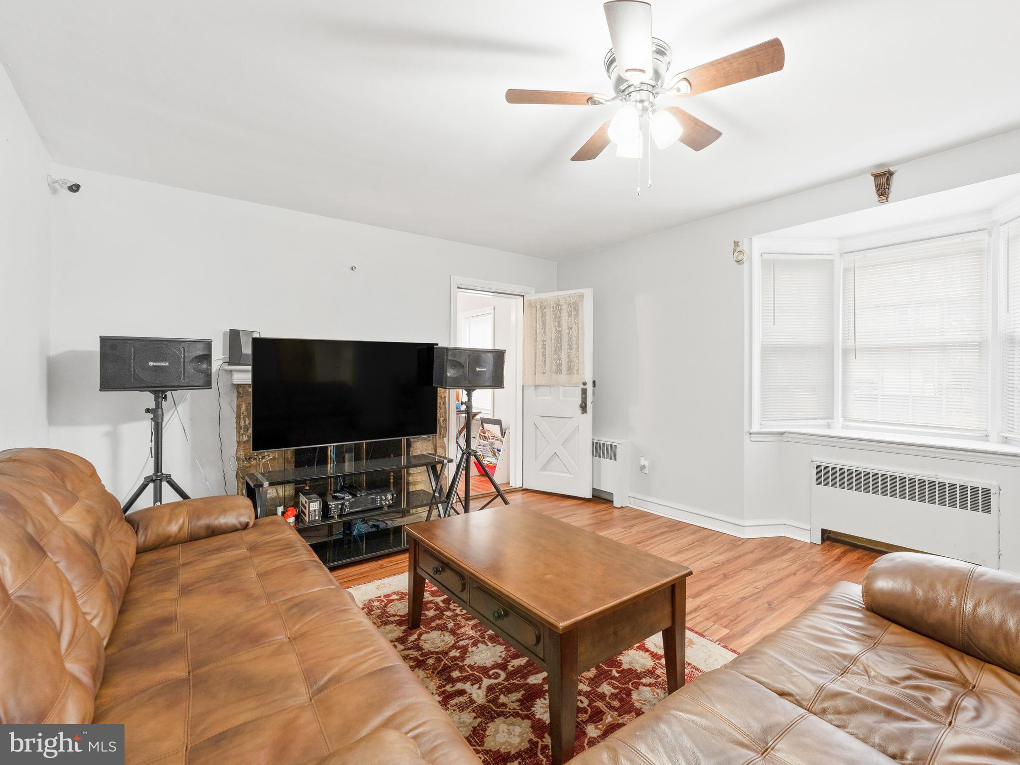 236 Boyer Road Cheltenham, PA 19012 - Photo 4 of 34 a living room with furniture and a flat screen tv