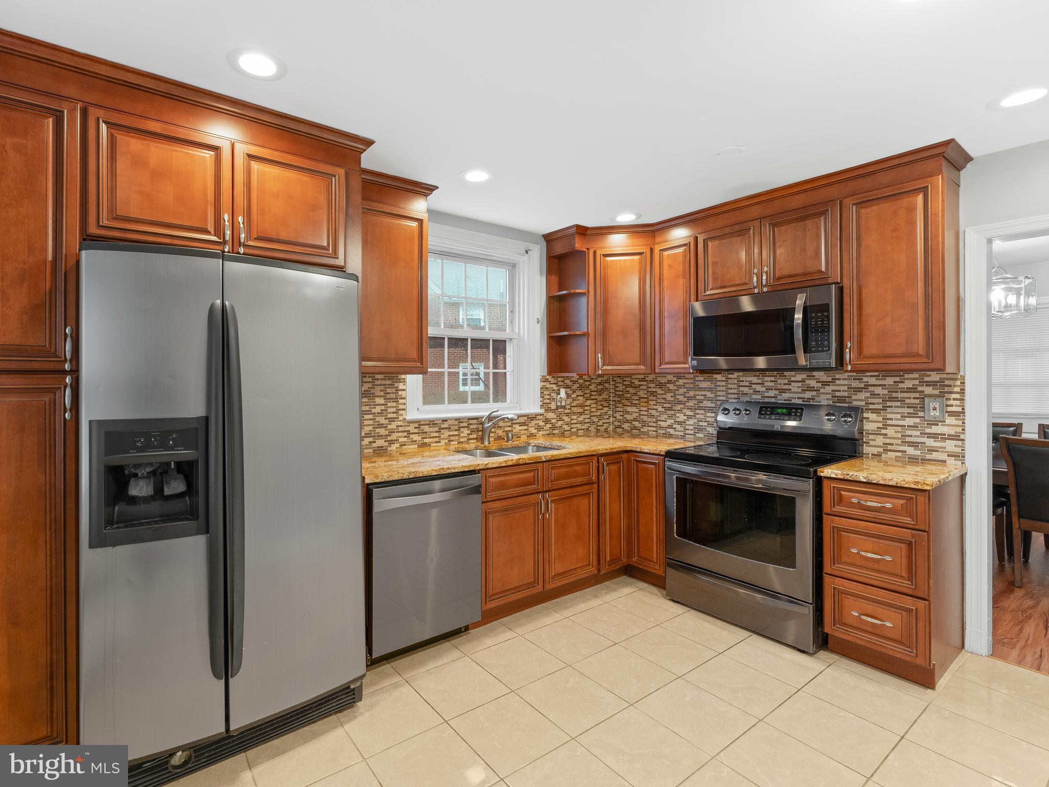 236 Boyer Road Cheltenham, PA 19012 - Photo 6 of 34 a kitchen with stainless steel appliances granite countertop a refrigerator stove and oven
