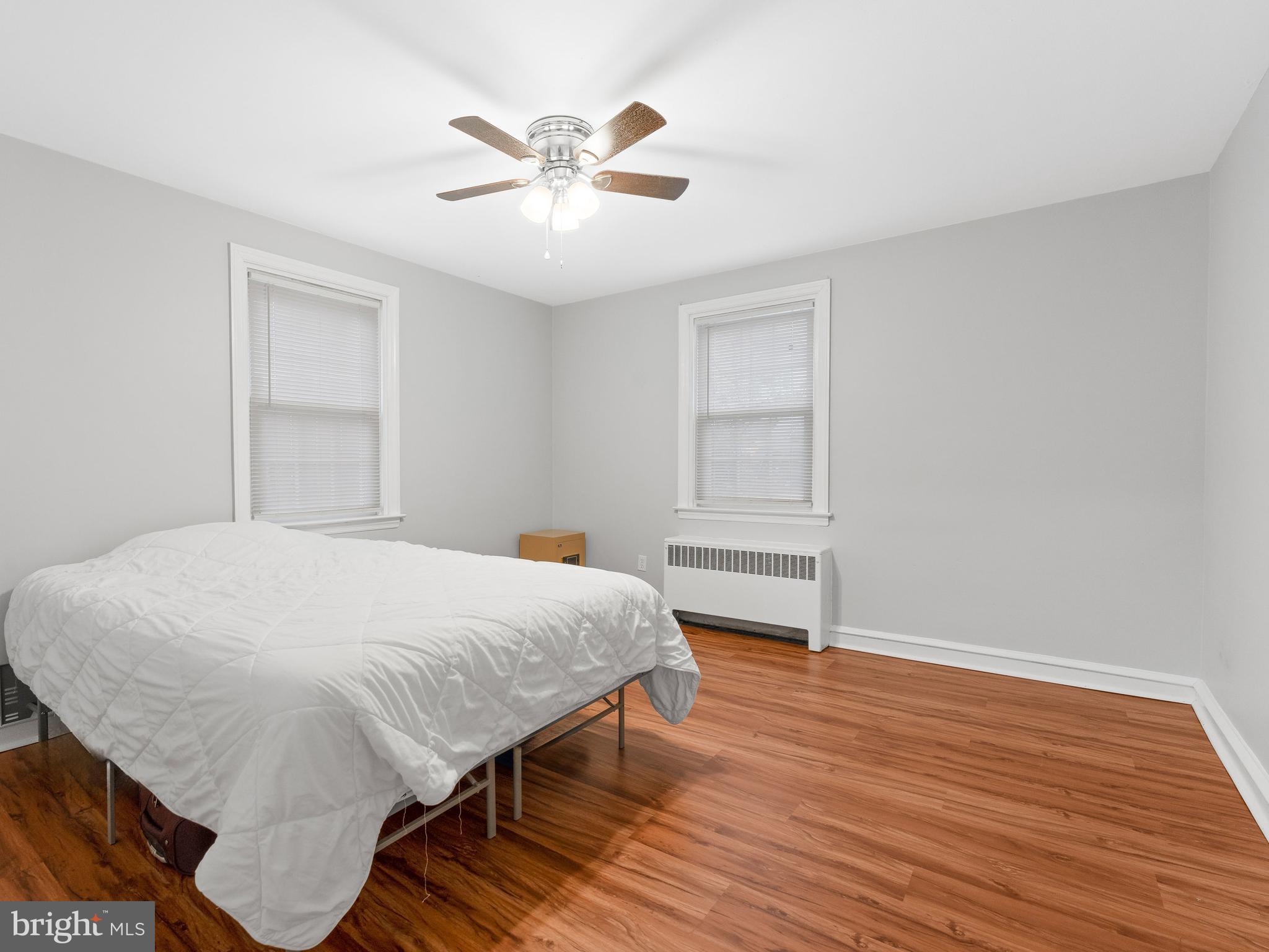 236 Boyer Road Cheltenham, PA 19012 - Photo 10 of 34 a bedroom with a bed and a chandelier