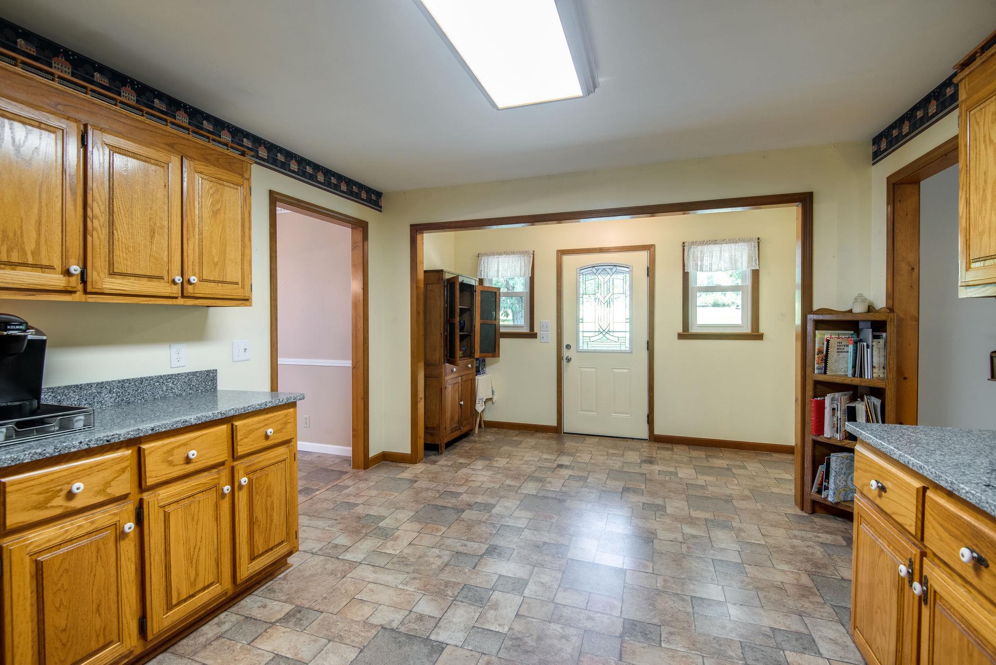 7357 Swift Road Greenbrier, TN 37073 - Photo 13 of 30 a view of a kitchen with furniture and staircase
