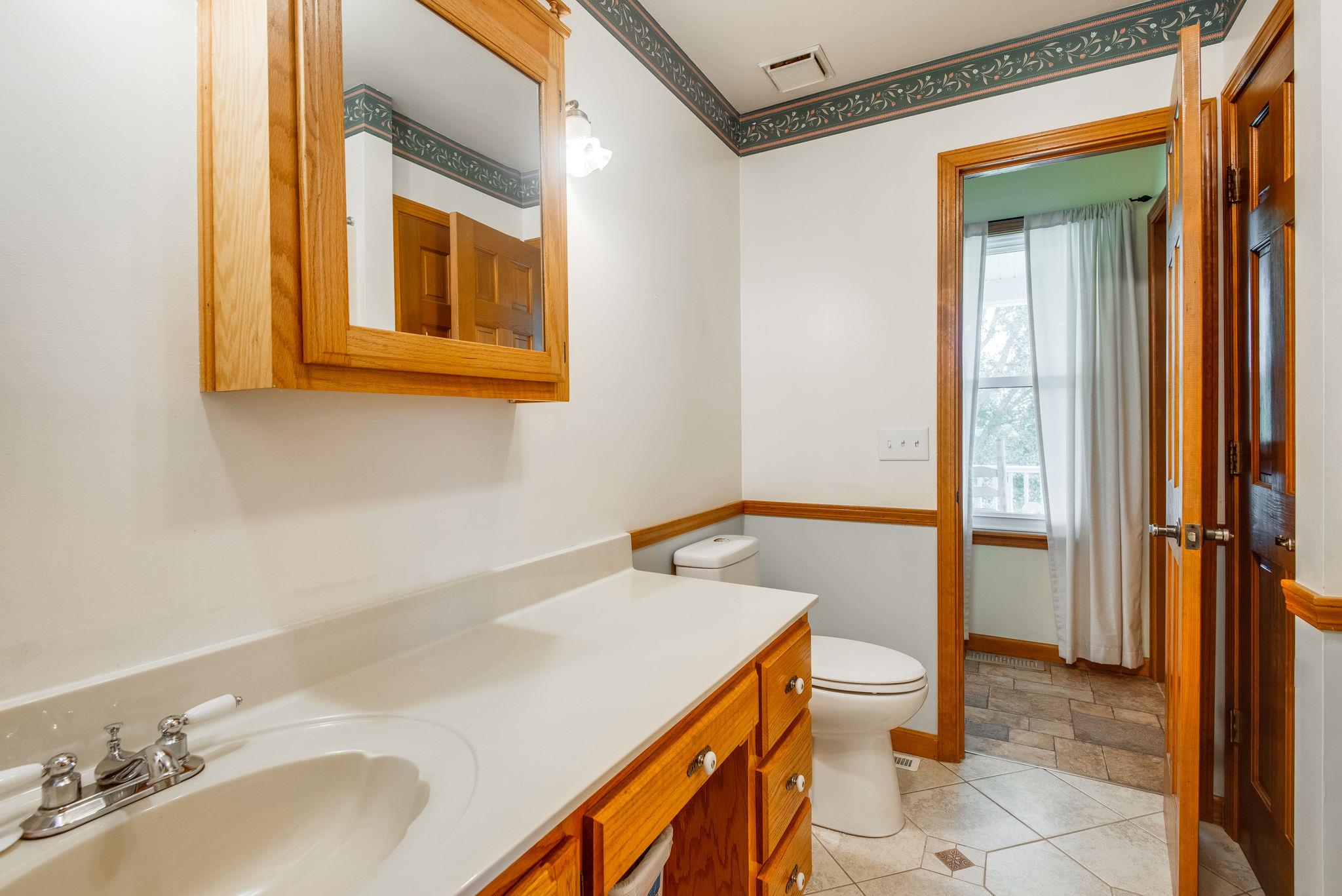 7357 Swift Road Greenbrier, TN 37073 - Photo 15 of 30 a bathroom with a sink and a mirror