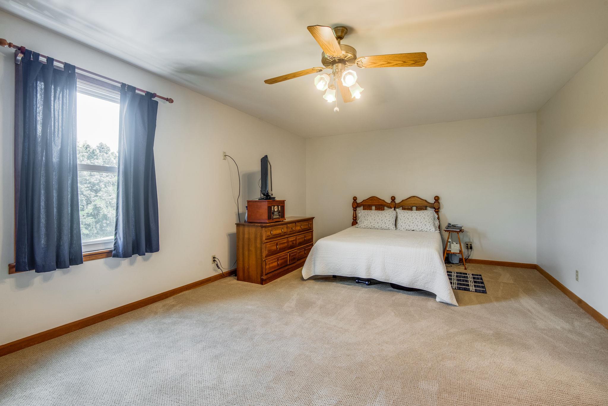 7357 Swift Road Greenbrier, TN 37073 - Photo 16 of 30 a bedroom with bed and window