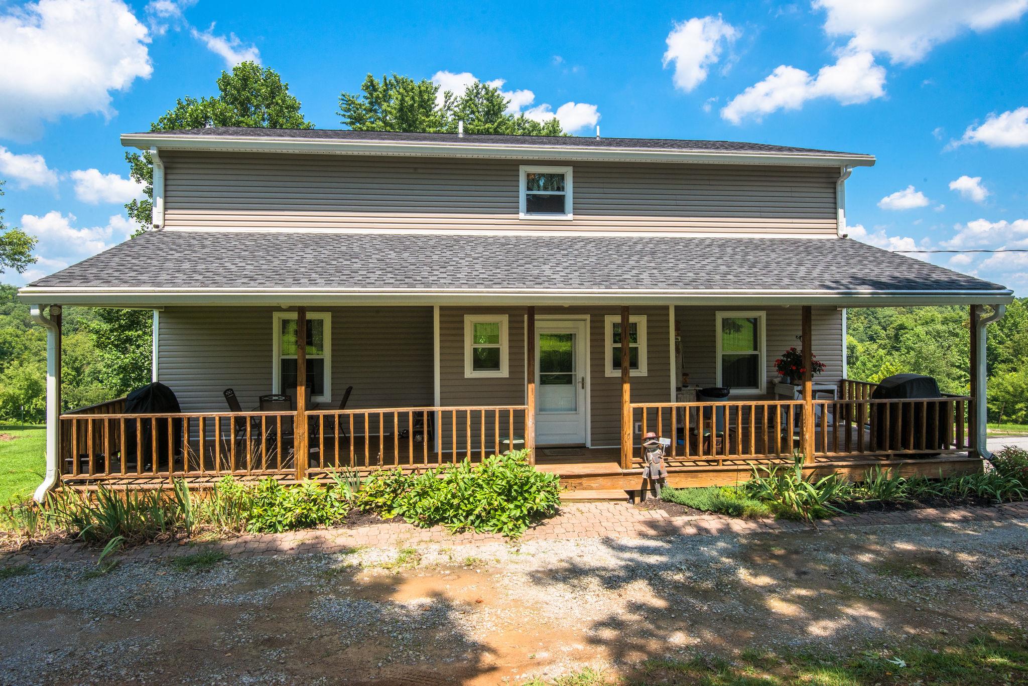 7357 Swift Road Greenbrier, TN 37073 - Photo 21 of 30 a front view of a house with a garden