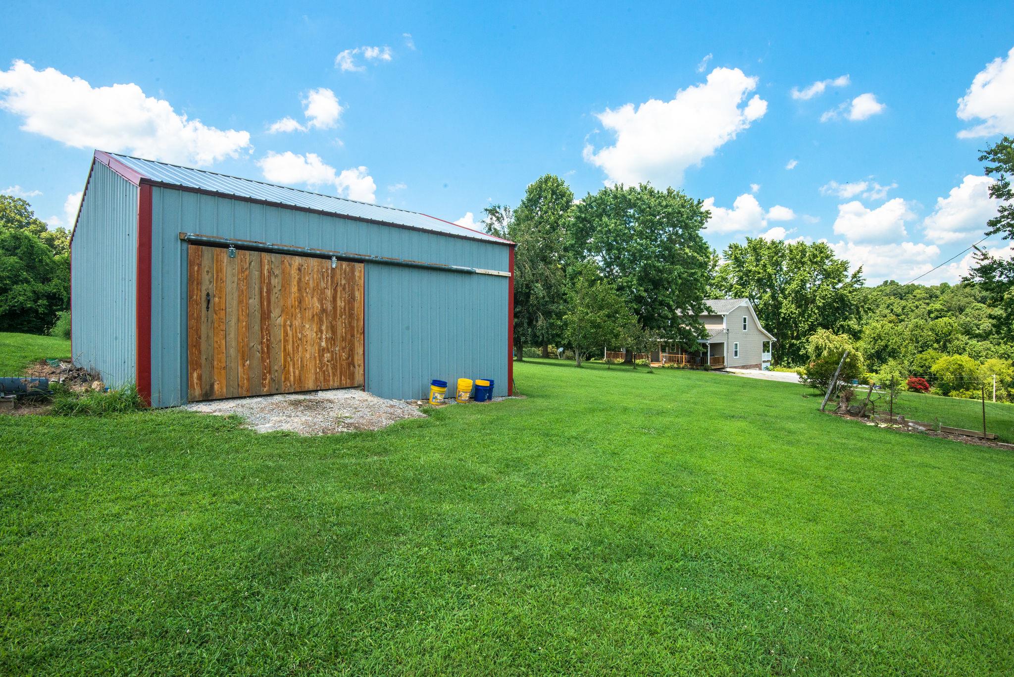 7357 Swift Road Greenbrier, TN 37073 - Photo 22 of 30 a view of an house with backyard space and garden