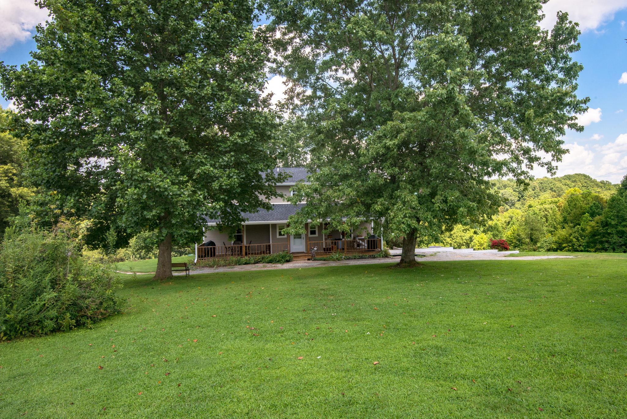 7357 Swift Road Greenbrier, TN 37073 - Photo 23 of 30 a view of a house with a big yard and large trees