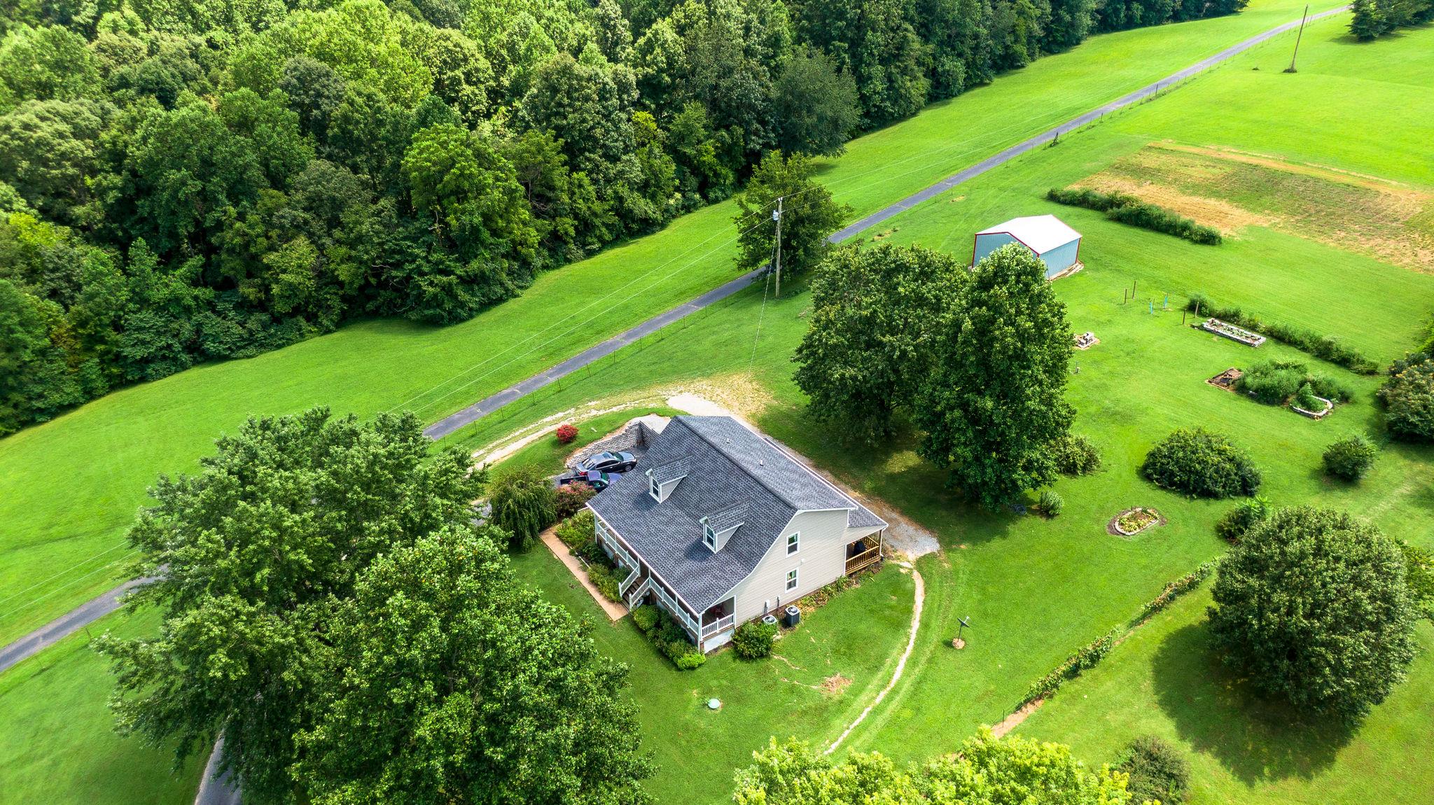 7357 Swift Road Greenbrier, TN 37073 - Photo 24 of 30 a view of a big yard with large trees