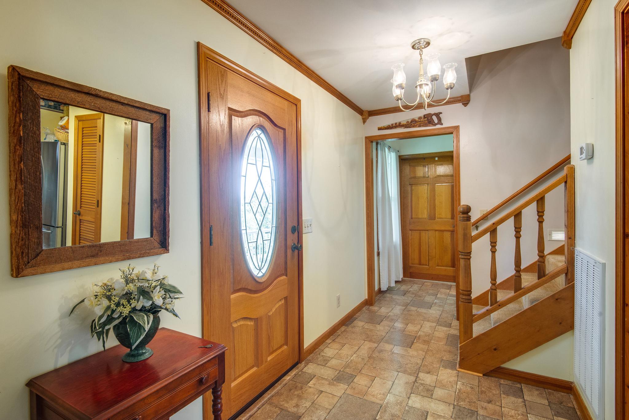 7357 Swift Road Greenbrier, TN 37073 - Photo 7 of 30 a view of a entryway door with wooden floor