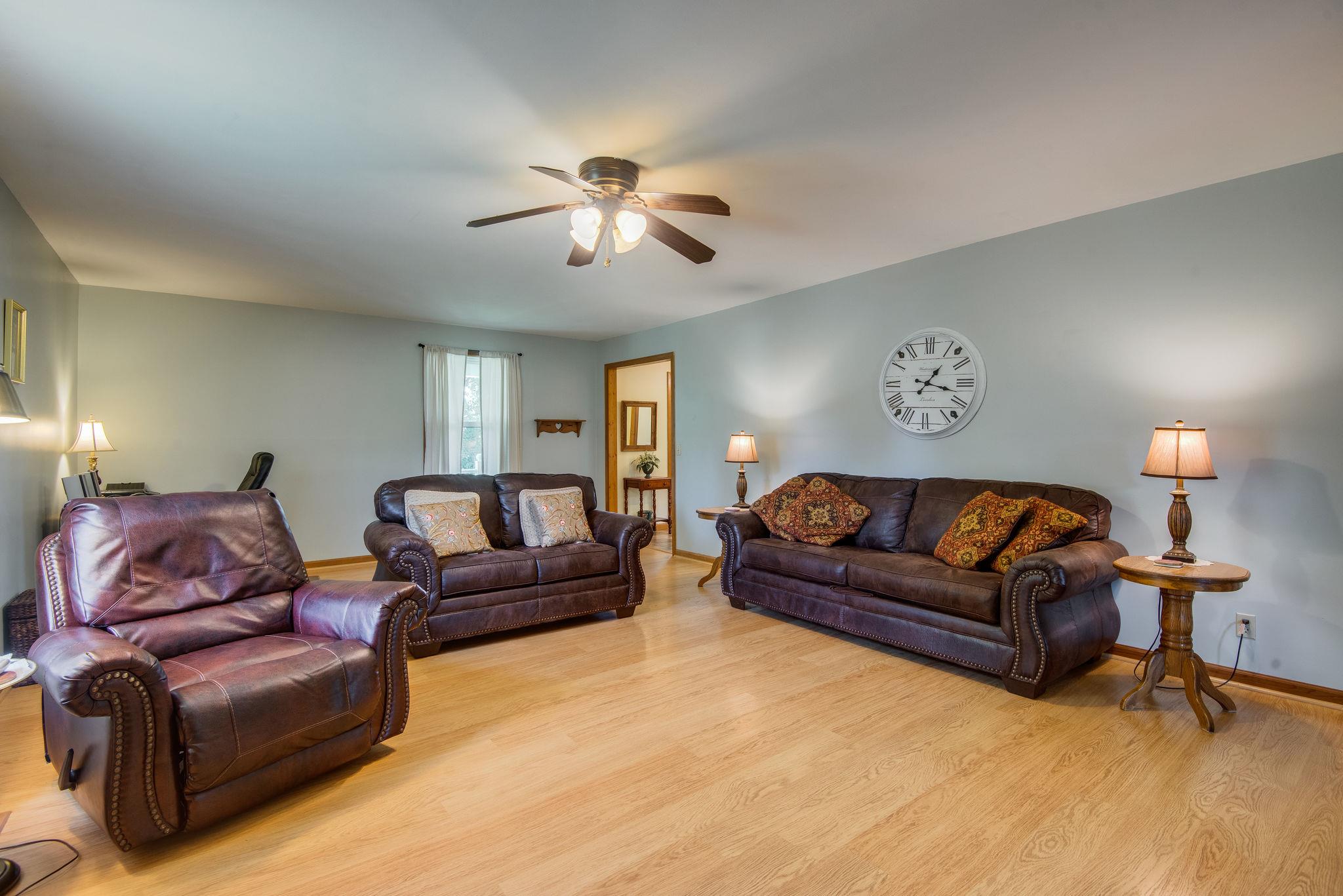 7357 Swift Road Greenbrier, TN 37073 - Photo 9 of 30 a living room with furniture and a lamp