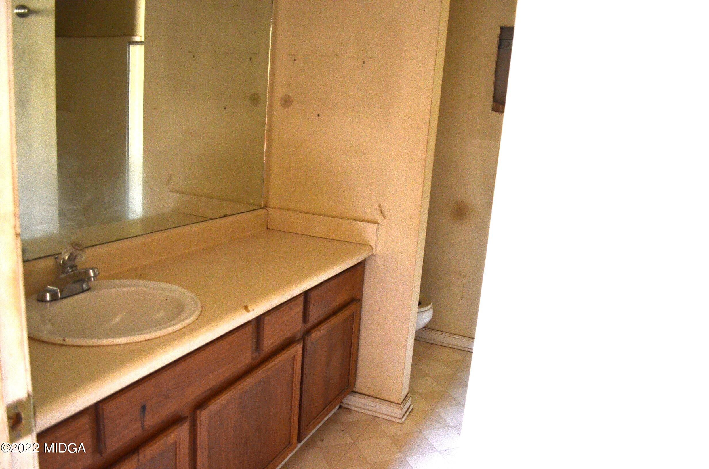 1754 Cummings Road Fort Valley, GA 31030 - Photo 8 of 28 a bathroom with a sink and a mirror