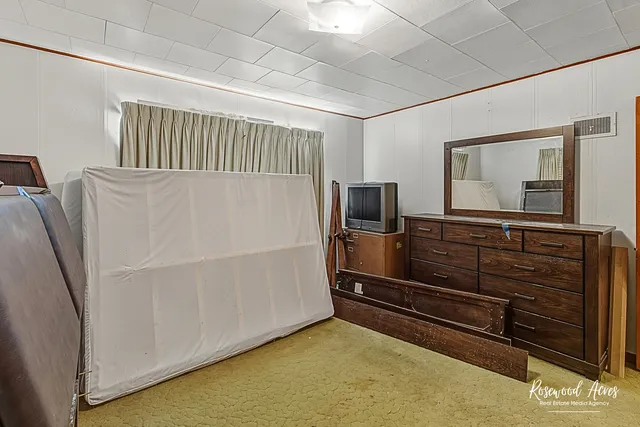 a livingroom with furniture and a flat screen tv