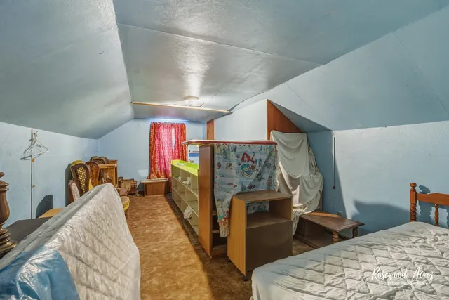 a bedroom with furniture and window