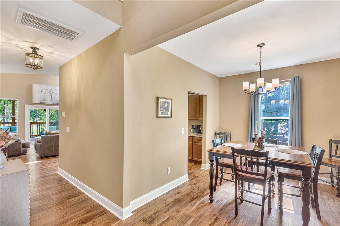 3004 Cobbs Way Anderson, SC 29621 - Photo 4 of 46 Gleaming hardwood floors flow from the bright dining area into the open hallway.