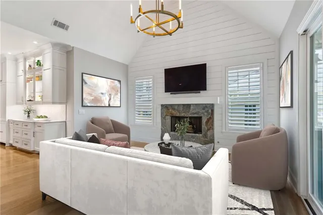 a dining room with furniture and wooden floor