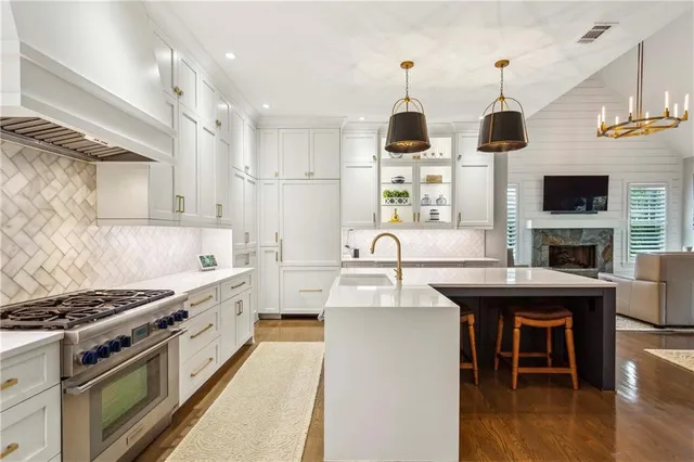 a dining room with furniture a flat screen tv and a fireplace