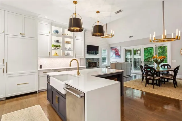 a view of a dining room with furniture and chandelier