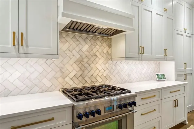 a bathroom with a toilet a sink a mirror a window and vanity