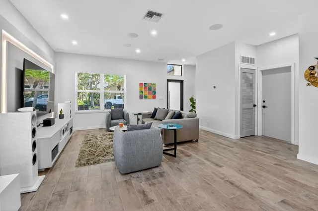 a kitchen with stainless steel appliances a sink and a refrigerator