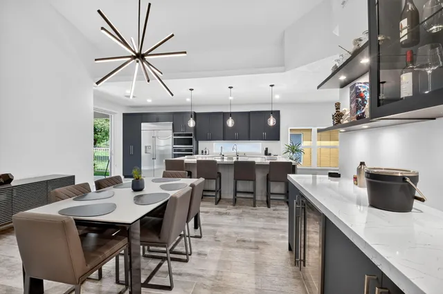 a kitchen with stainless steel appliances kitchen island a large island in the center