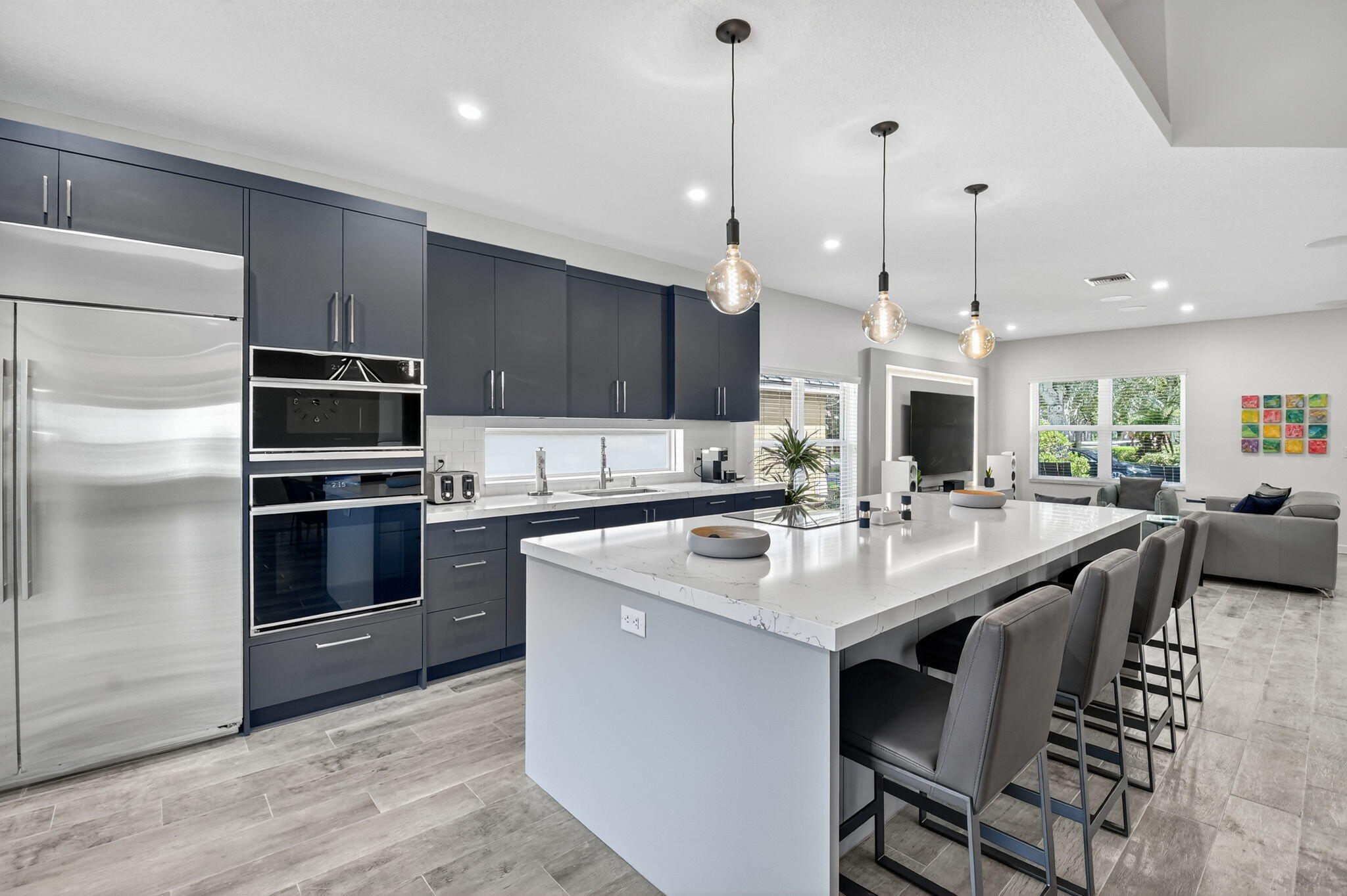 494 Enfield Court Delray Beach, FL 33444 - Photo 19 of 78 a kitchen with a center island appliances and cabinets