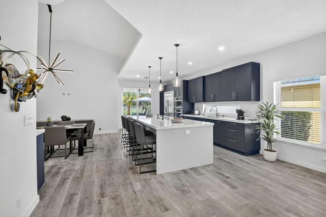 a bedroom with a bed and a ceiling fan