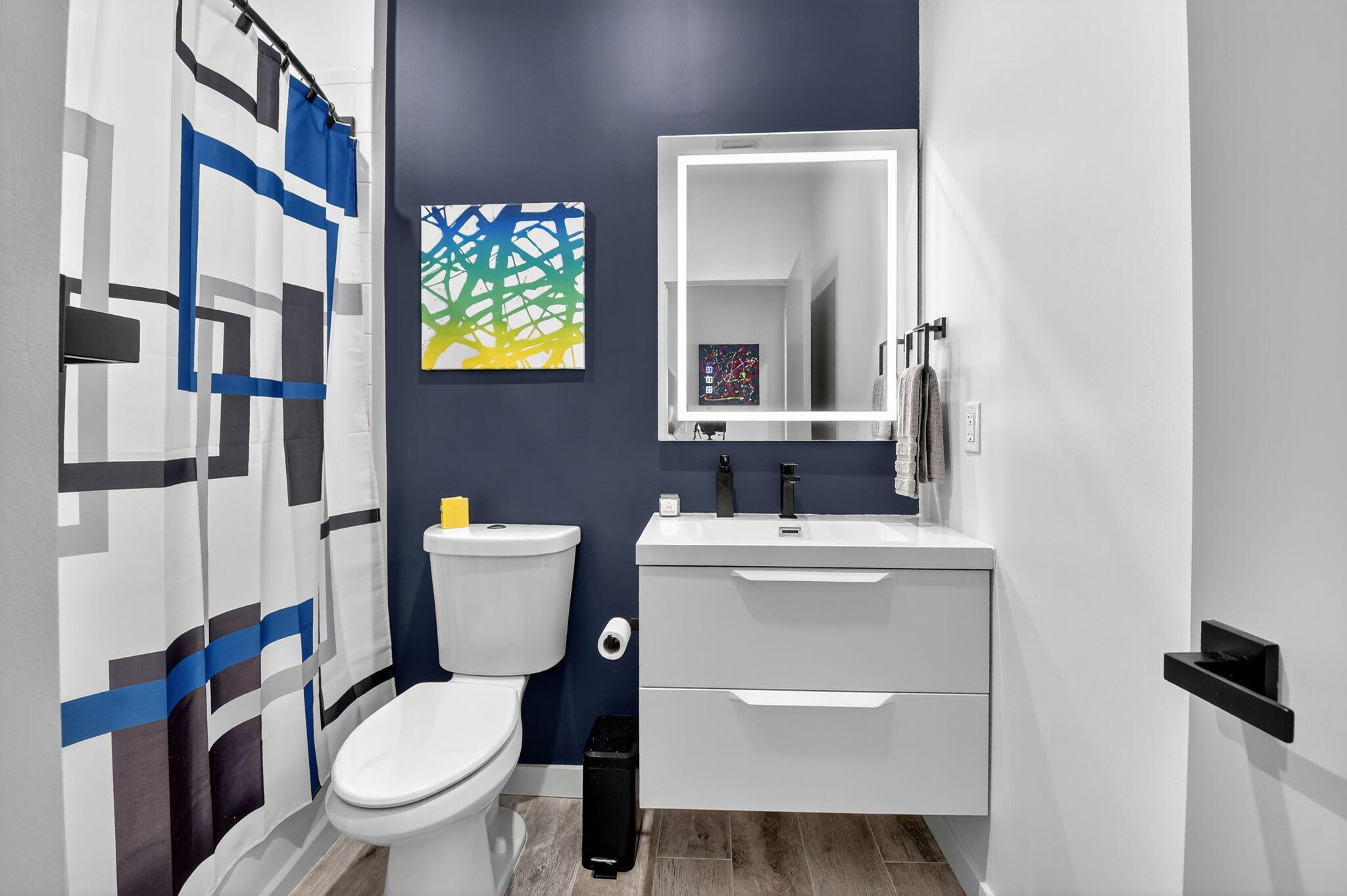 494 Enfield Court Delray Beach, FL 33444 - Photo 32 of 78 a bathroom with a toilet a sink and a mirror