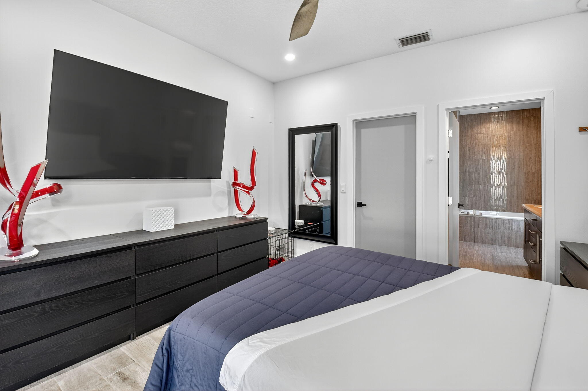 494 Enfield Court Delray Beach, FL 33444 - Photo 33 of 78 a bedroom with a bed and a flat screen tv