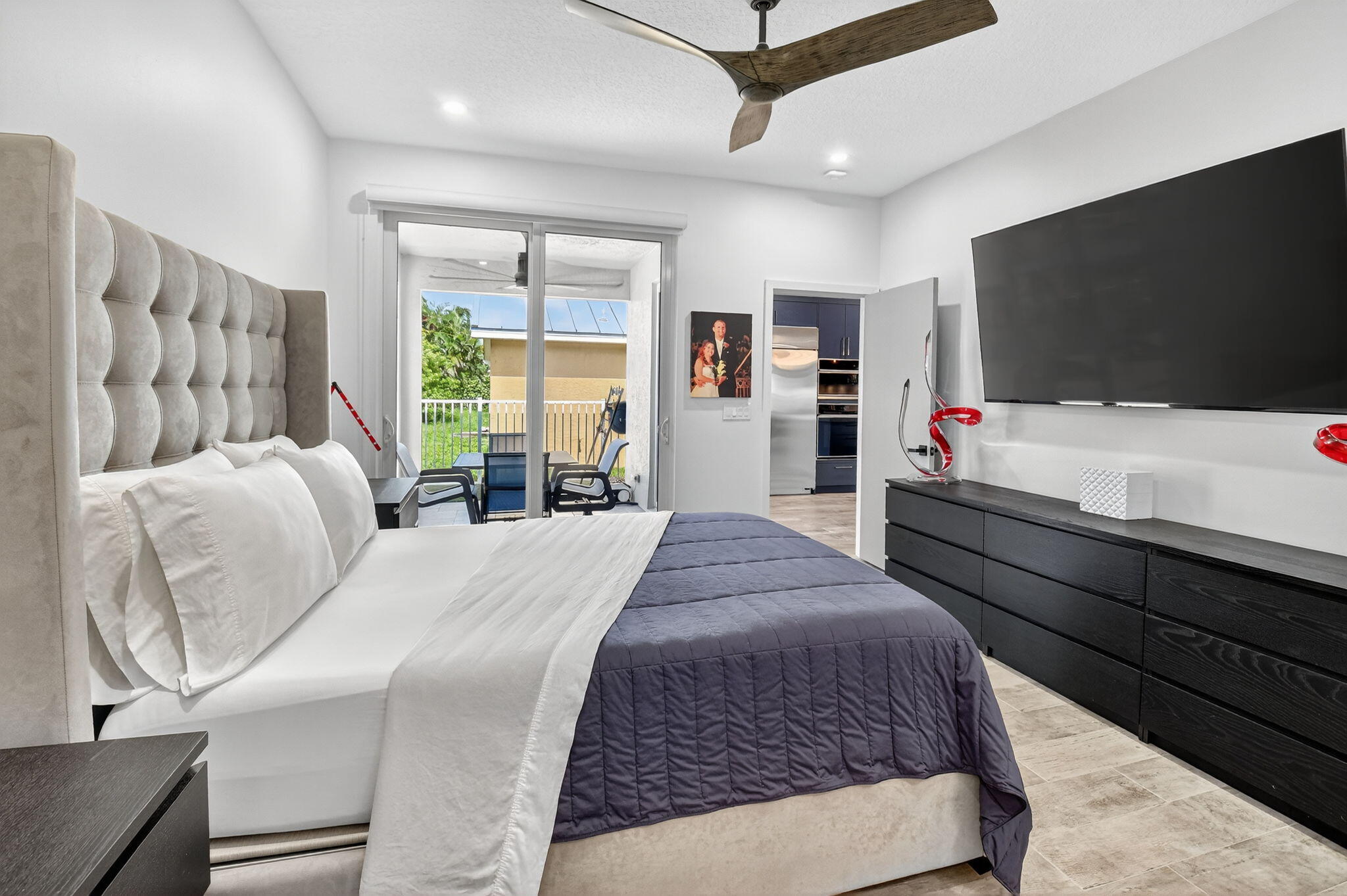 494 Enfield Court Delray Beach, FL 33444 - Photo 35 of 78 a bed room with a bed window and a television