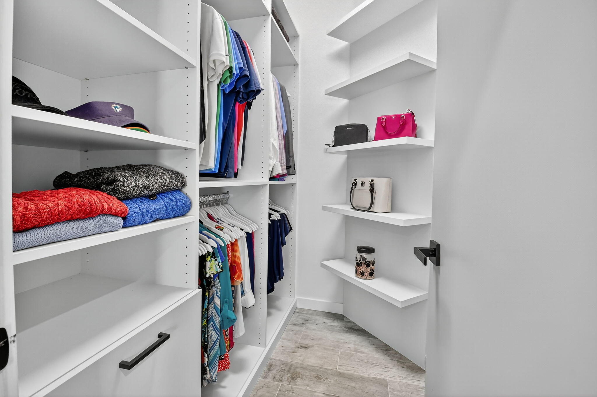 494 Enfield Court Delray Beach, FL 33444 - Photo 40 of 78 a view of walk in closet with clothes and shoes