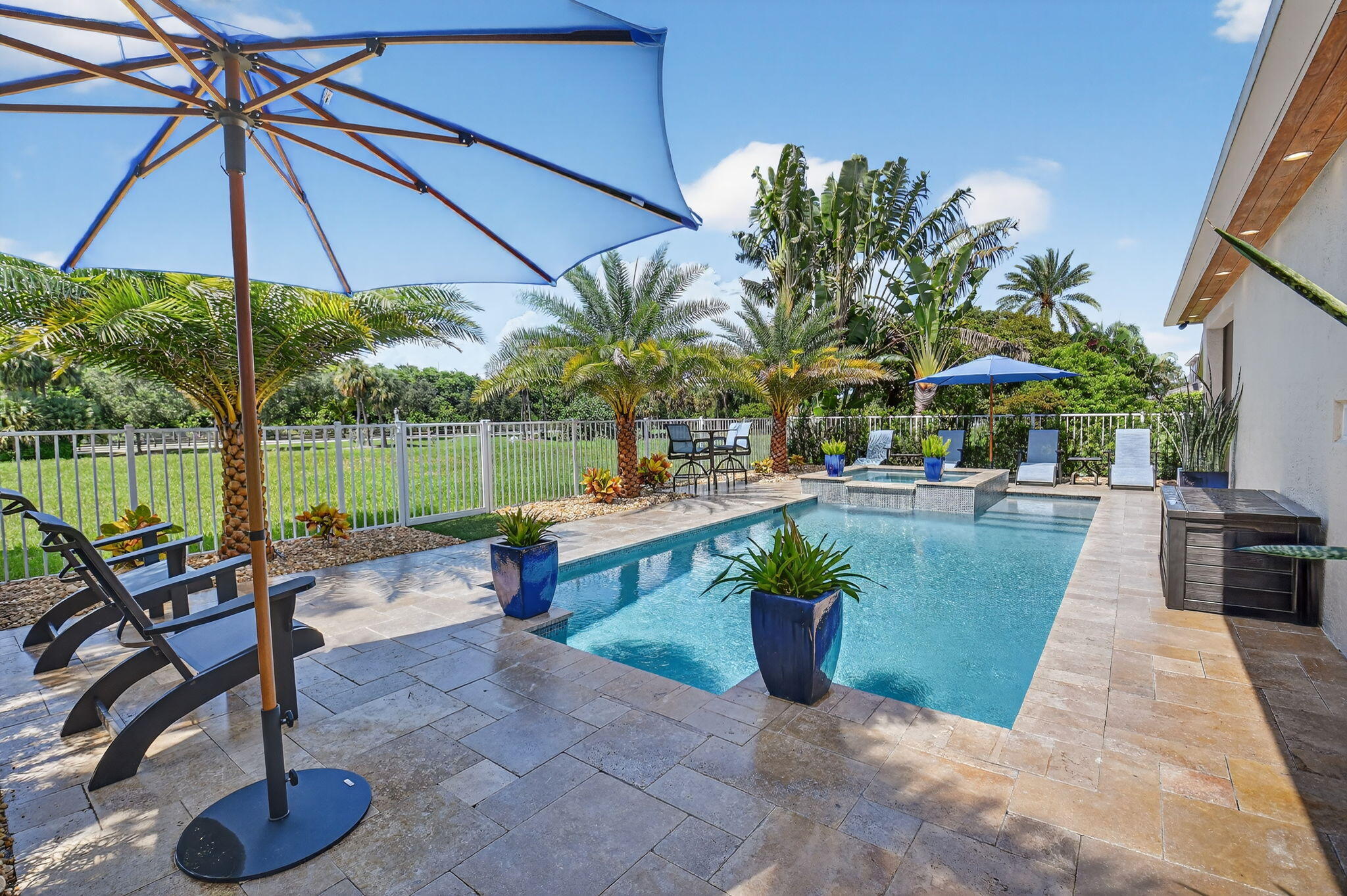 494 Enfield Court Delray Beach, FL 33444 - Photo 50 of 78 a view of a swimming pool with a patio and a garden