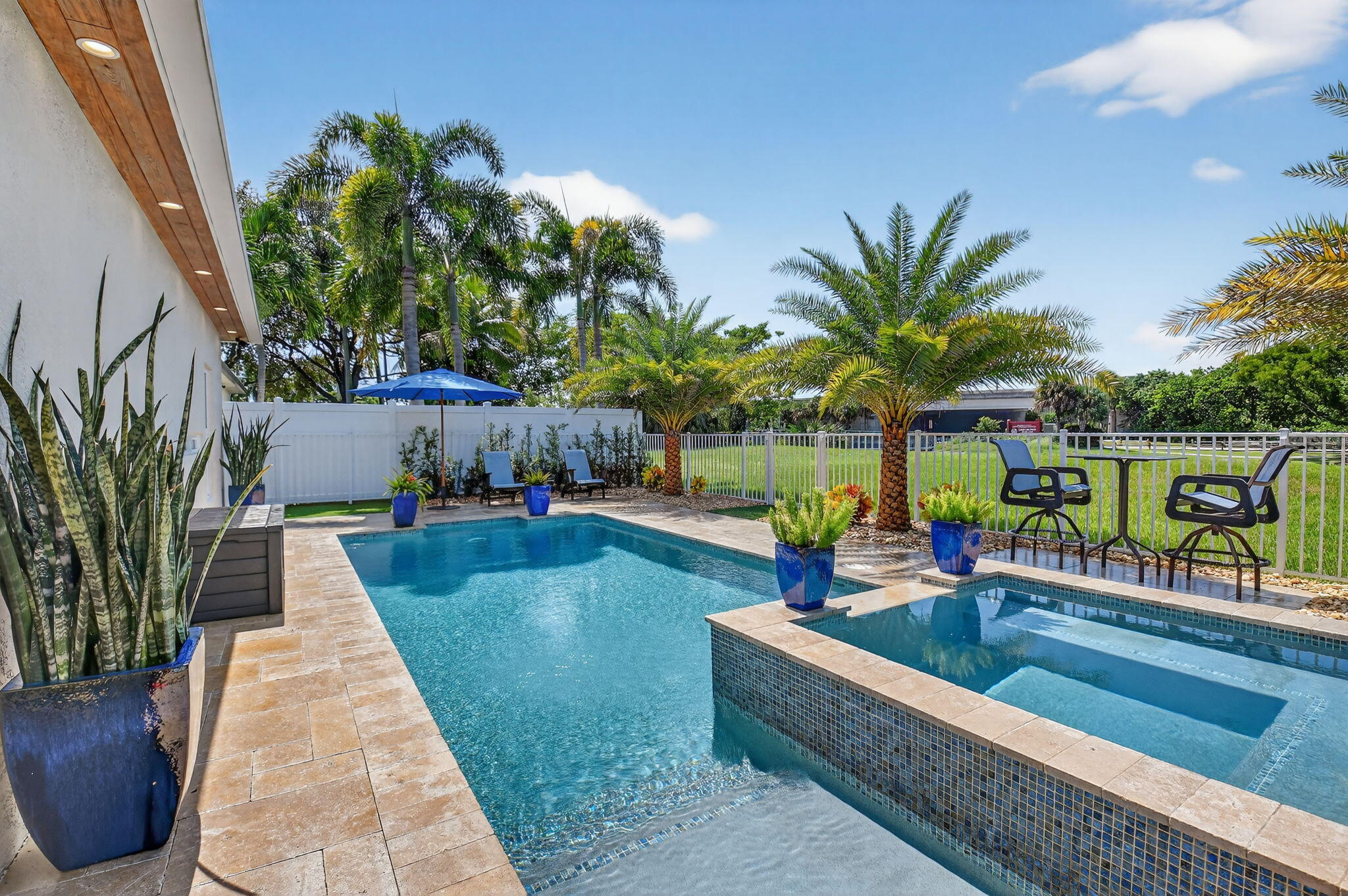 494 Enfield Court Delray Beach, FL 33444 - Photo 53 of 78 swimming pool view with a garden space