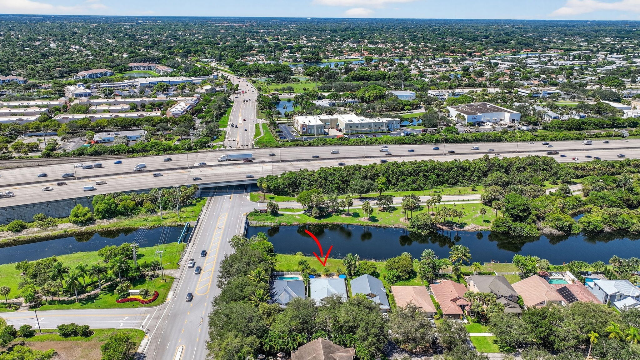 494 Enfield Court Delray Beach, FL 33444 - Photo 58 of 78 an aerial view of a city with lots of residential buildings ocean and mountain view in back