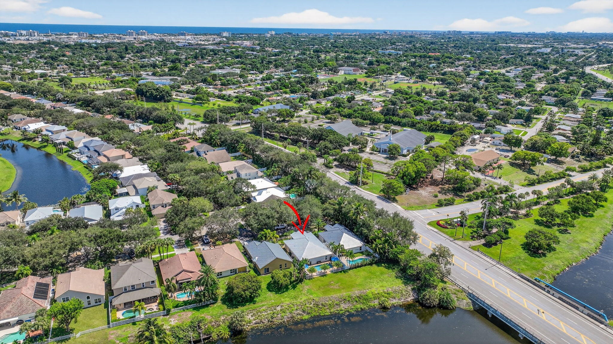 494 Enfield Court Delray Beach, FL 33444 - Photo 62 of 78 an aerial view of residential houses with outdoor space and trees
