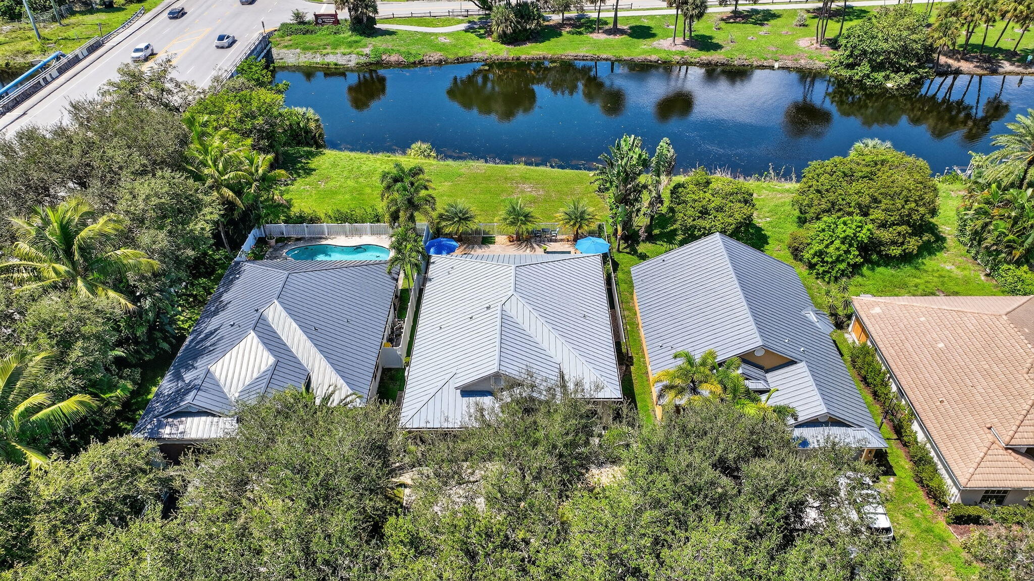494 Enfield Court Delray Beach, FL 33444 - Photo 69 of 78 an aerial view of a house with a yard and lake view
