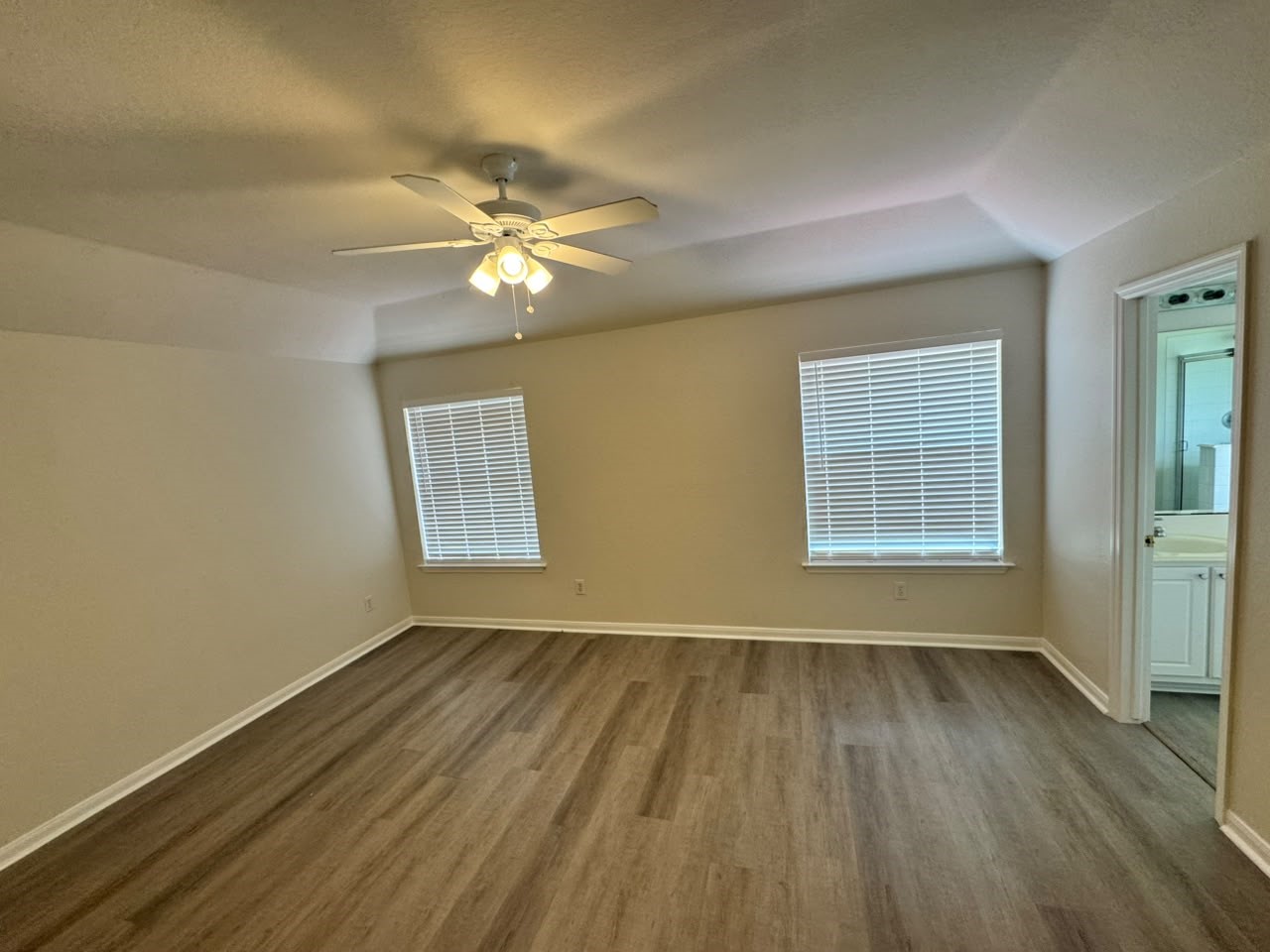 2110 Ridge Wood Lane Sugar Land, TX 77479 - Photo 20 of 23 wooden floor in an empty room with a window