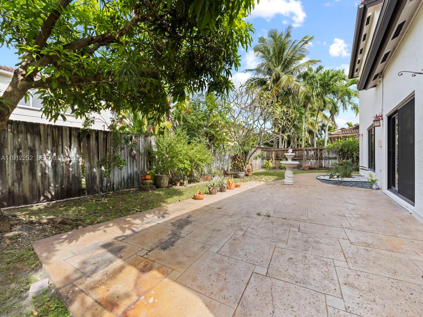15871 Southwest 141st Street Miami, FL 33196 - Photo 33 of 41 a view of backyard and tree