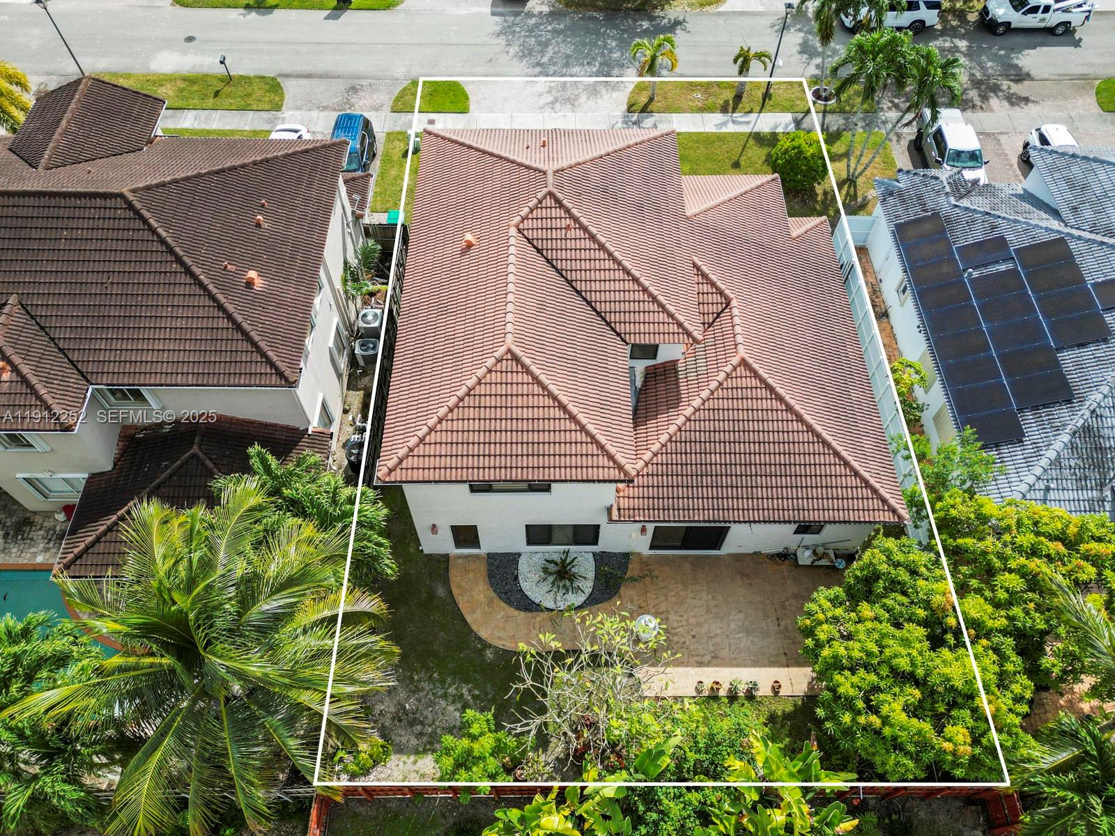 15871 Southwest 141st Street Miami, FL 33196 - Photo 38 of 41 an aerial view of a house with garden space and sitting area