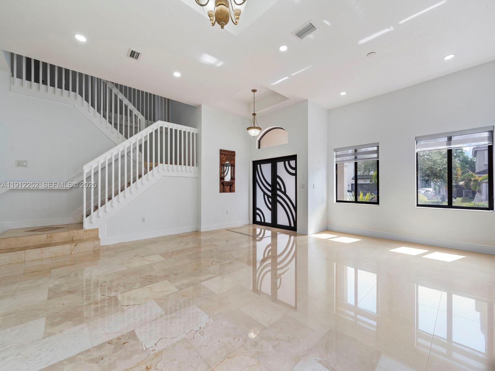 15871 Southwest 141st Street Miami, FL 33196 - Photo 6 of 41 a view of entryway and hall with a chair