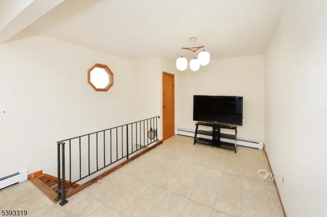 a view of a livingroom with a flat screen tv
